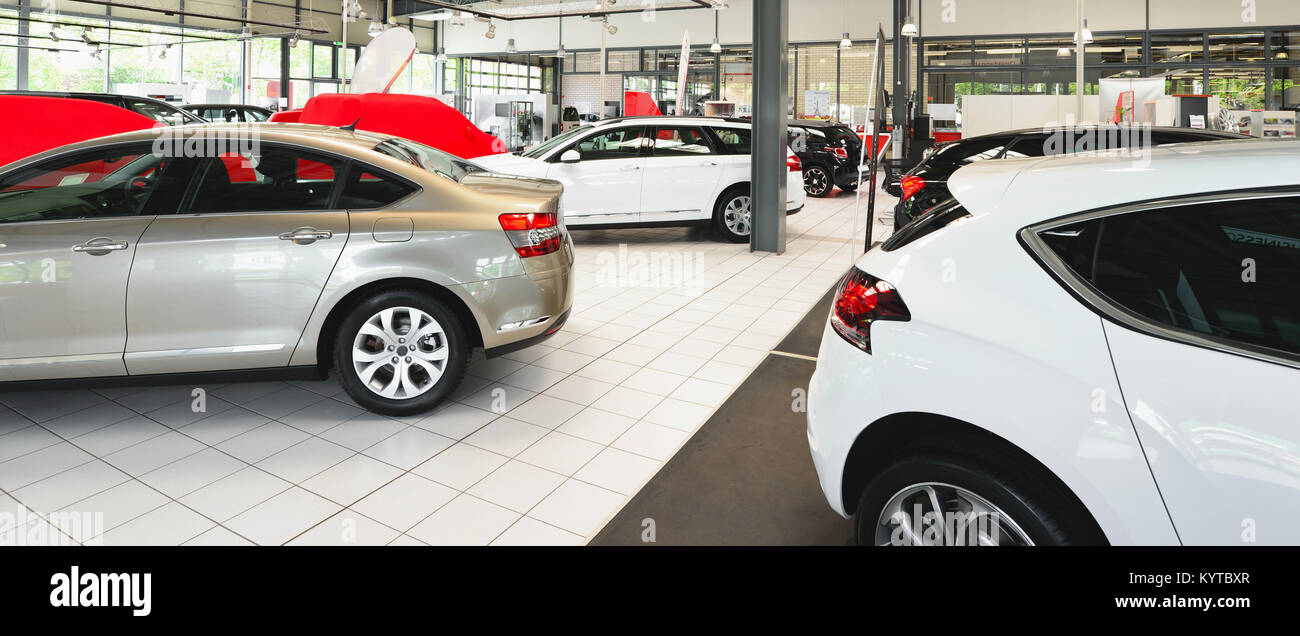 New Cars In The Sales Area Of A Car Dealership Building And