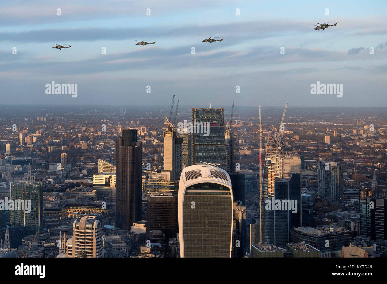 Four Lynx helicopters flying over The City in London, as seen from The ...