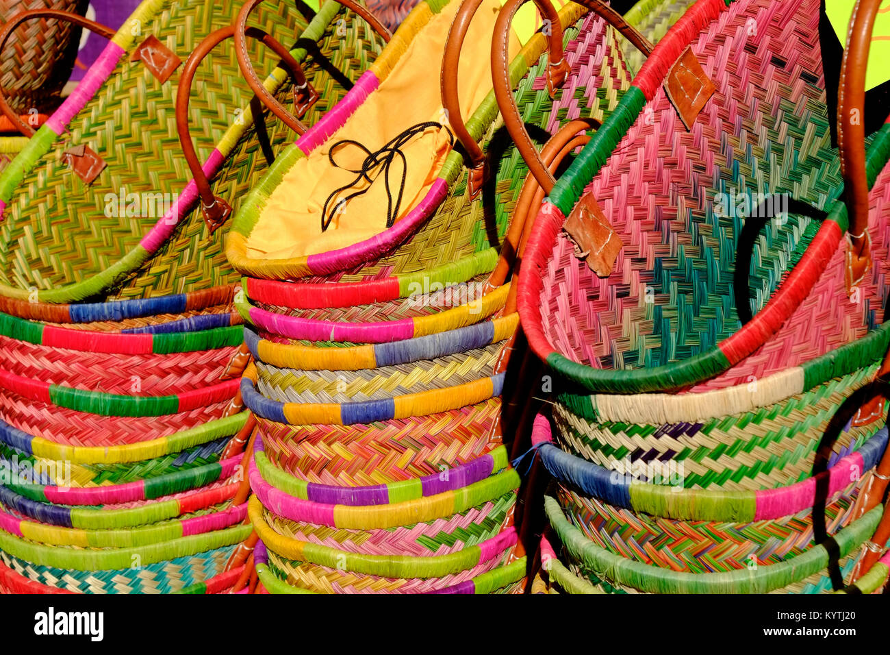 Colourful shopping baskets full frame close up displayed on a market