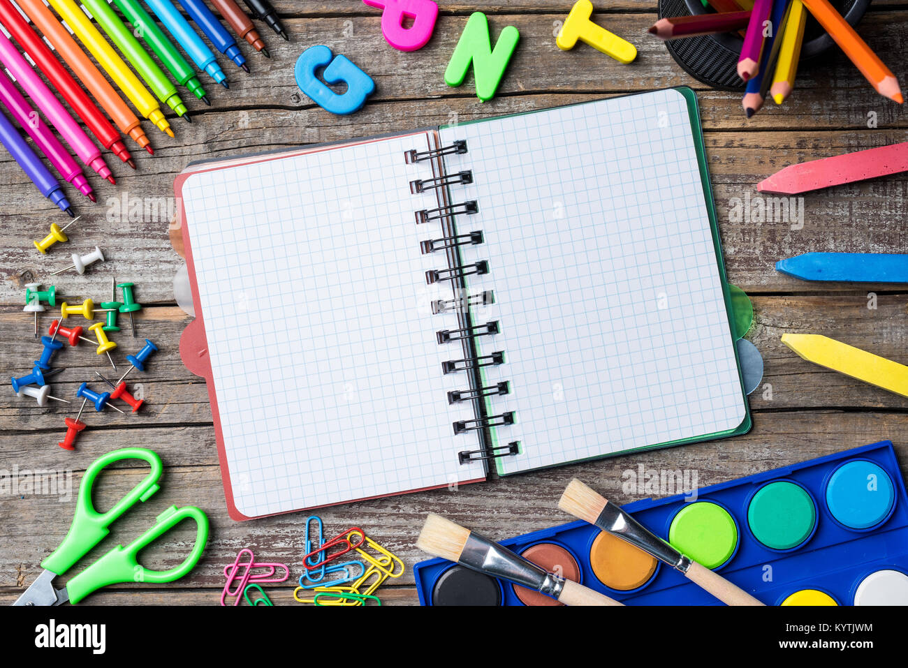 School supplies or accessories on an old wooden table Stock Photo