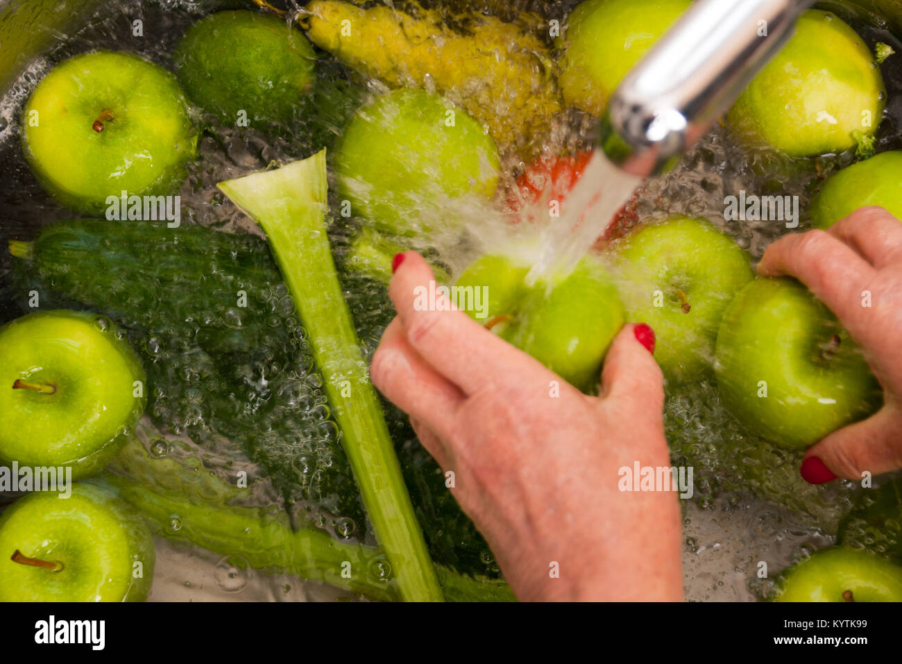 Hand washing fruit High Resolution Stock Photography and Images Alamy