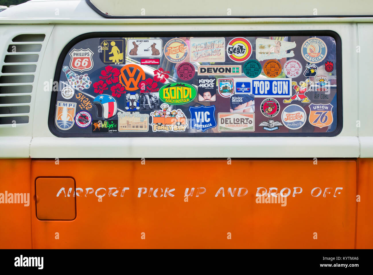 Orange VW Volkswagen camper van abstract with stickers in the window. UK Stock Photo