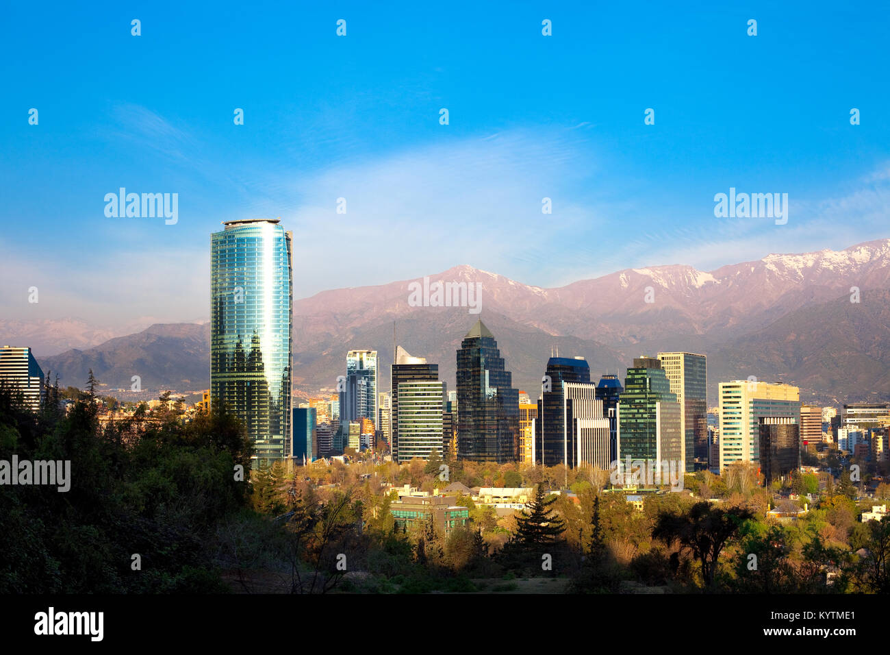 Skyline of Modern buildings in Santiago de Chile with The Andes Mountain Range in the back Stock Photo