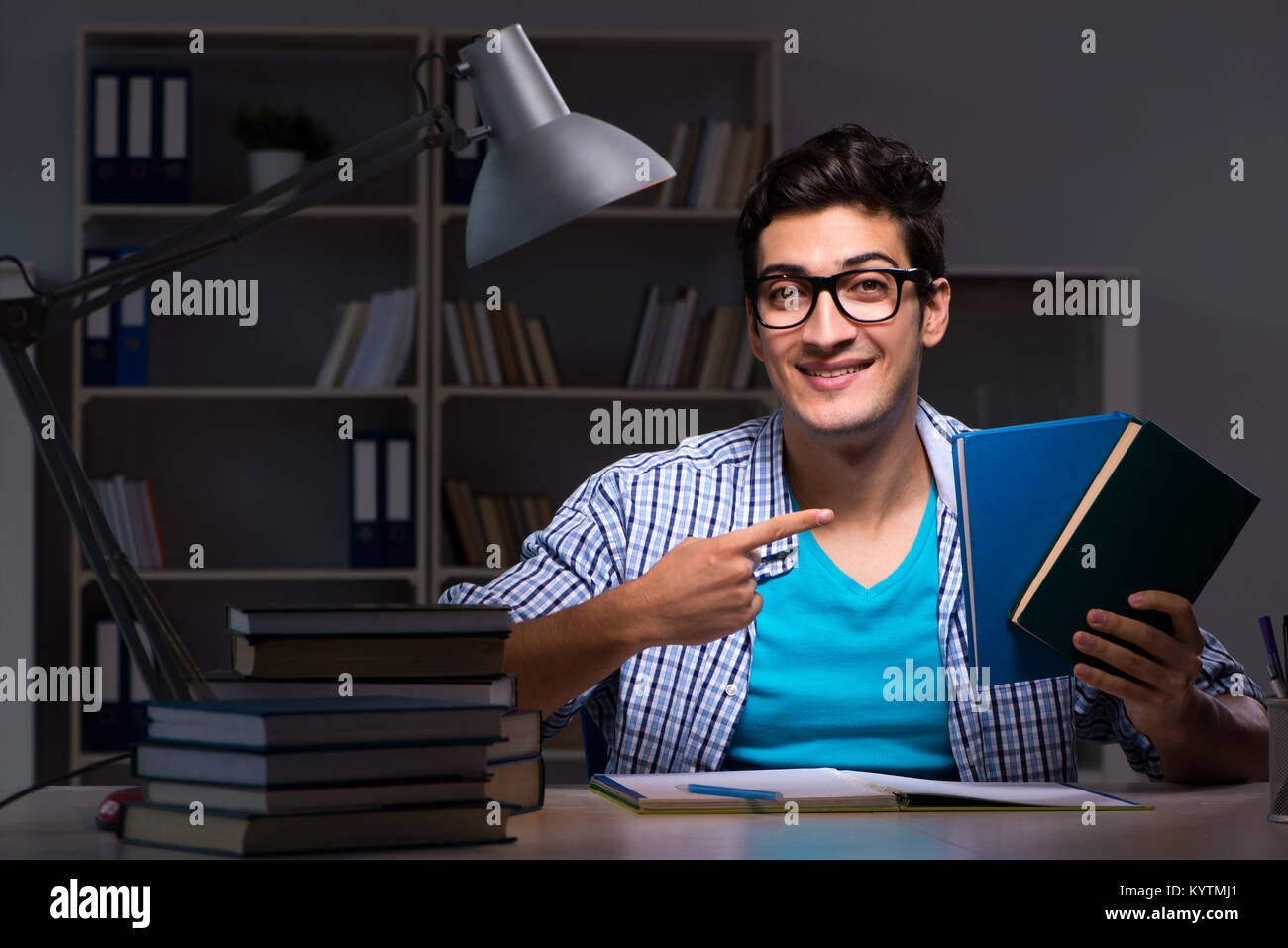Student preparing for exams late night at home Stock Photo - Alamy