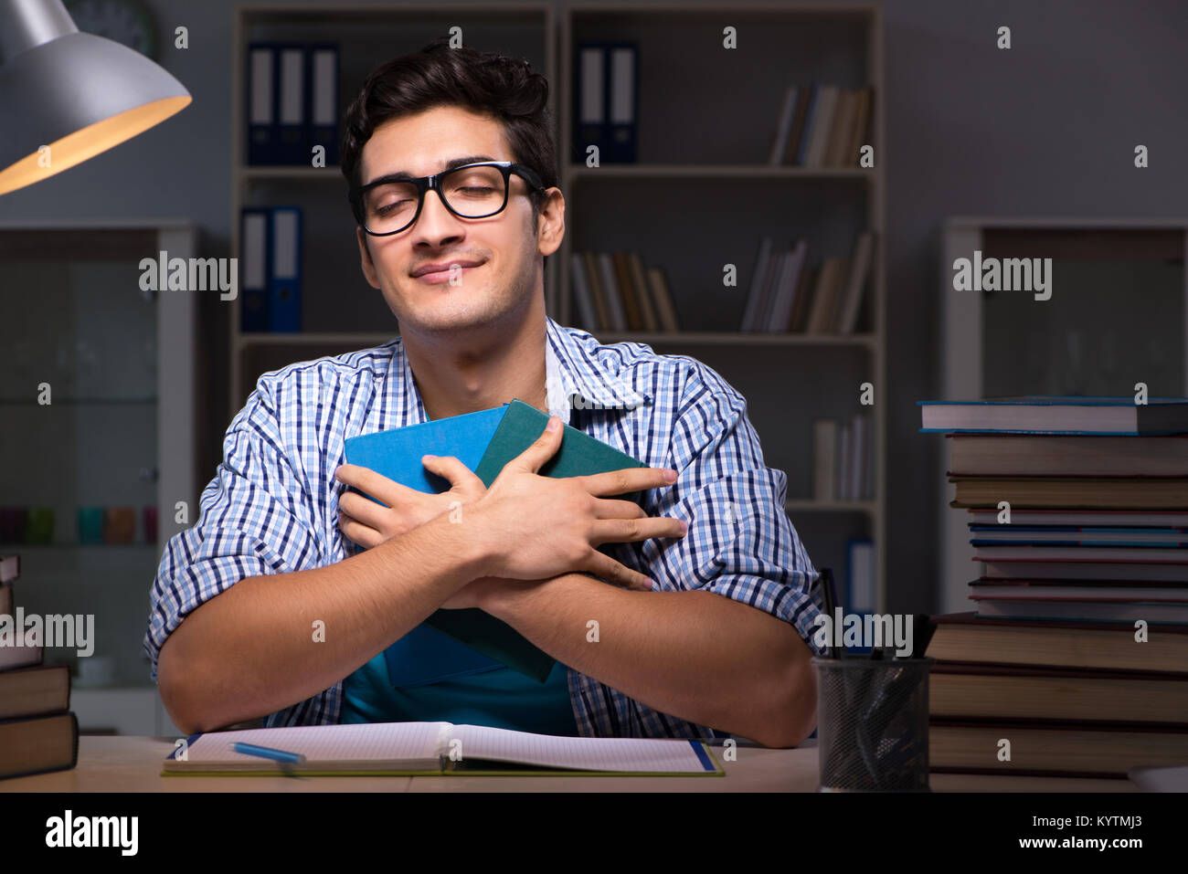 Student preparing for exams late night at home Stock Photo - Alamy