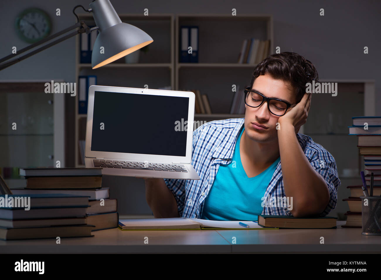 Student preparing for exams late night at home Stock Photo - Alamy