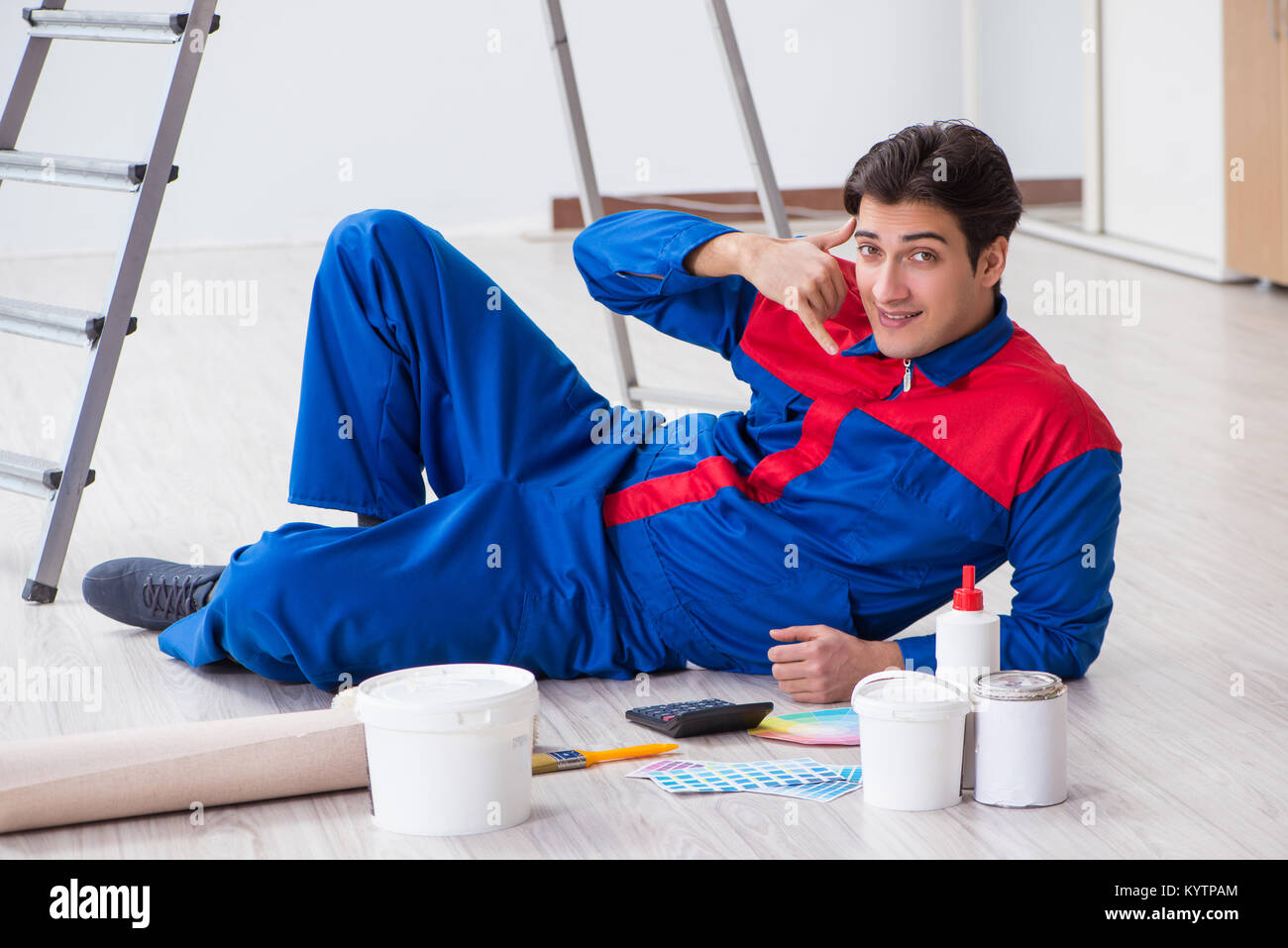 Young painter trying to match colours for painting job Stock Photo Alamy