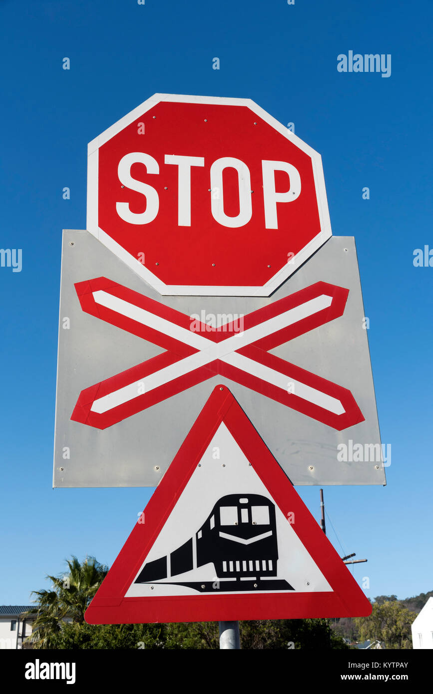 Road sign for a railway crossing at Darling in the Western Cape South Africa. December 2017.Railroad warning stop sign approaching train Stock Photo