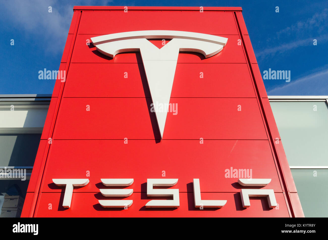 Large sign with Tesla logo outside the Tesla Store and Service Centre in Birmingham Stock Photo