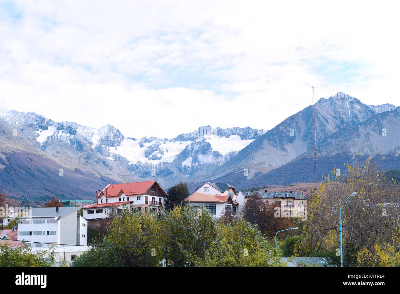 View of houses with snowy mountains at the back in Ushuaia, Patagonia, Argentina. Stock Photo