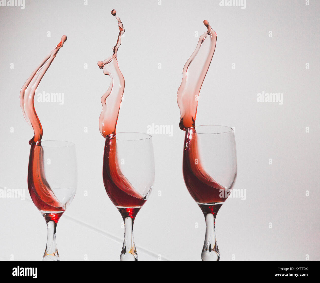 Graphic image of wine sloshing from a wine glasses.  January 2018 Stock Photo