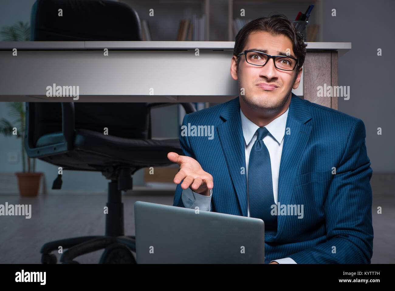 Businessman working overtime long hours late in office Stock Photo - Alamy