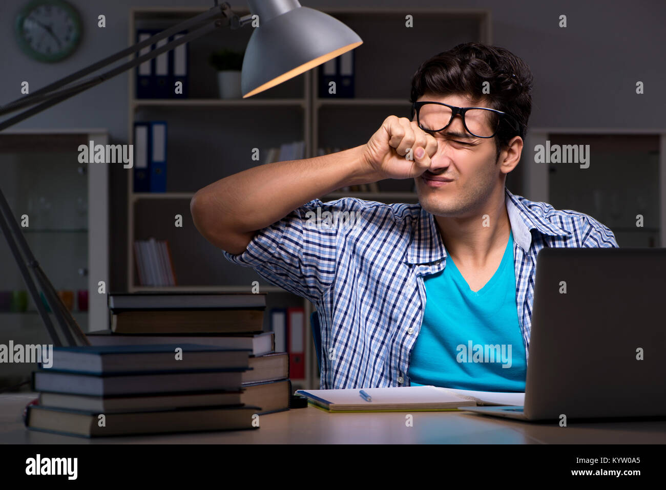 Student preparing for exams late night at home Stock Photo - Alamy