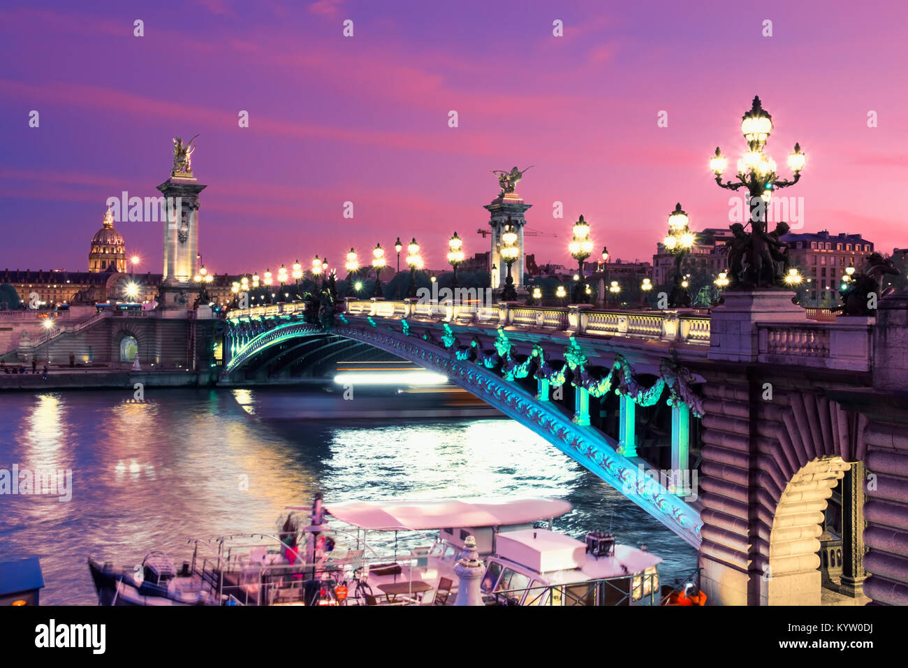 Alexandre Bridge in Paris at night in illumination, toned image. Stock Photo