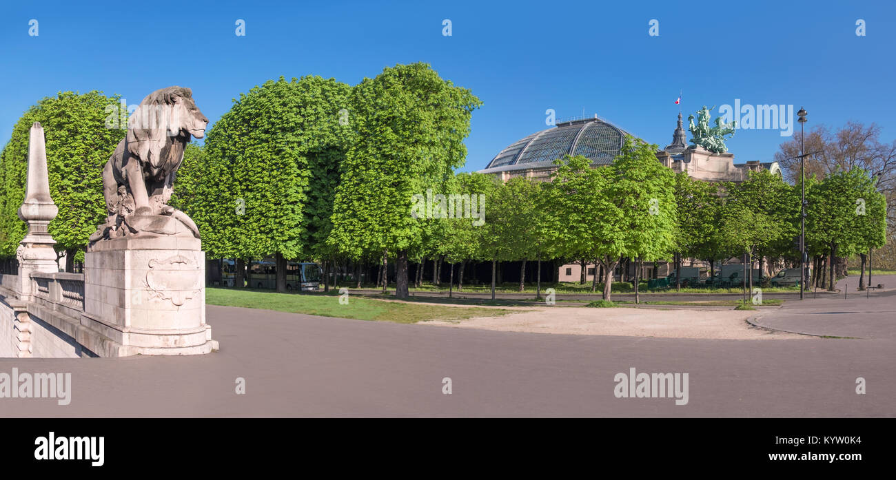 Lion statue at the entrance to Alexandre Bridge and Grand Palais in Paris, France. Panorama image, space for your text Stock Photo