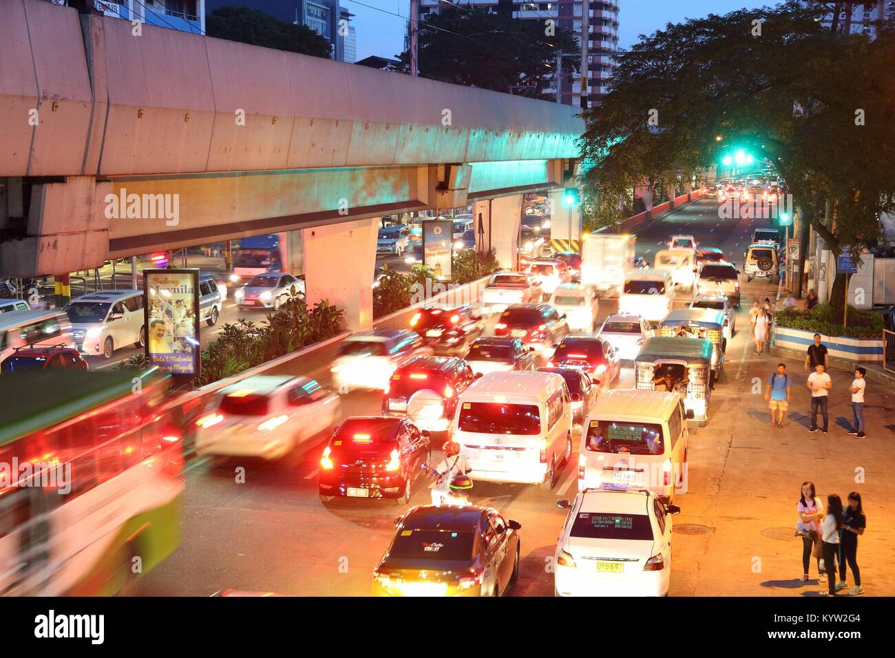 MANILA, PHILIPPINES - NOVEMBER 25, 2017: People drive in heavy traffic in Manila, Philippines. Metro Manila is one of the biggest urban areas in the w Stock Photo