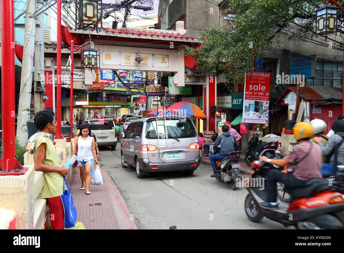 MANILA, PHILIPPINES - NOVEMBER 25, 2017: People visit Chinatown in Manila, Philippines. Metro Manila is one of the biggest urban areas in the world wi Stock Photo