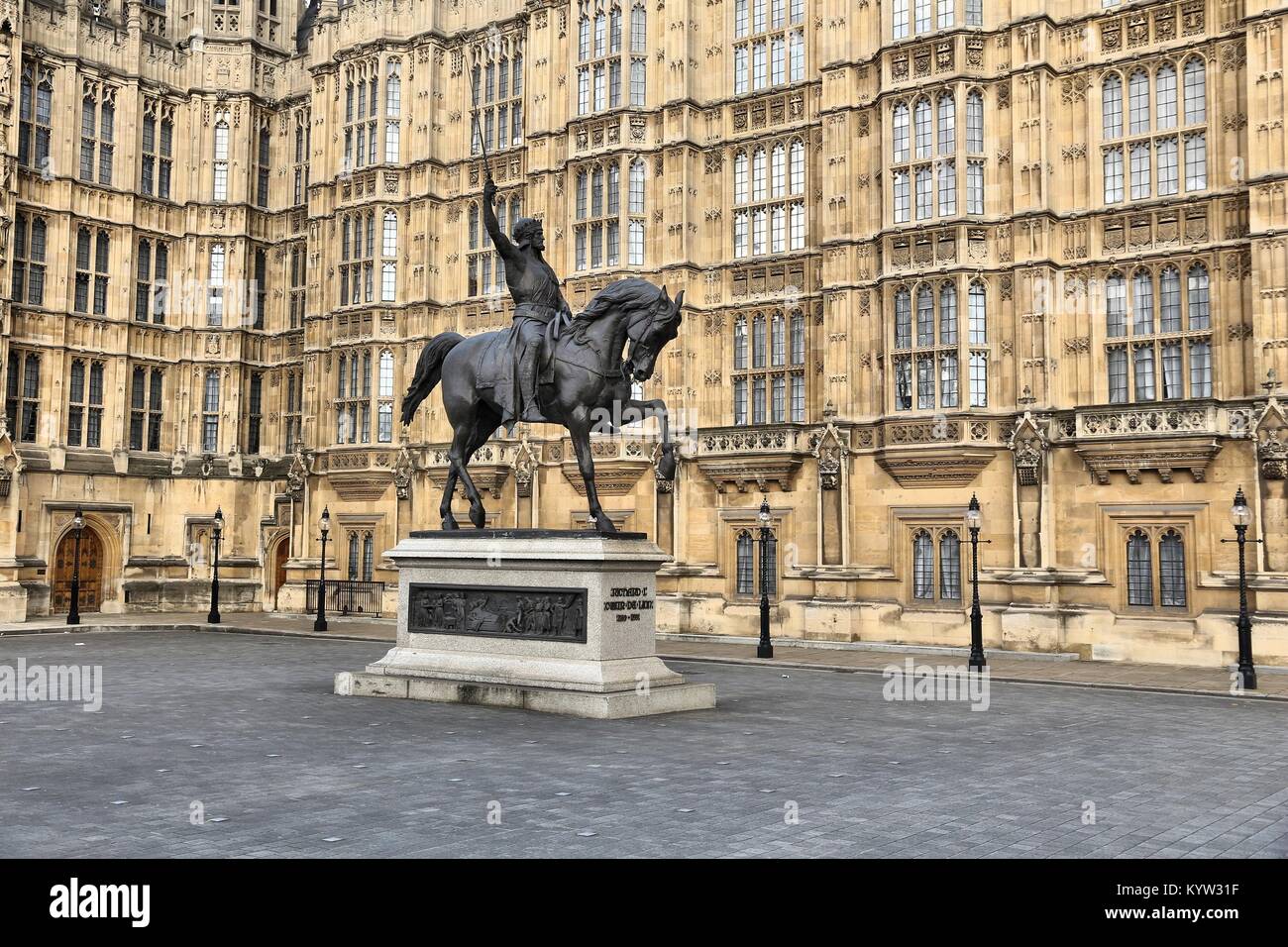 London, England - Palace of Westminster (Houses of Parliament) with Richard Lionheart statue. Stock Photo