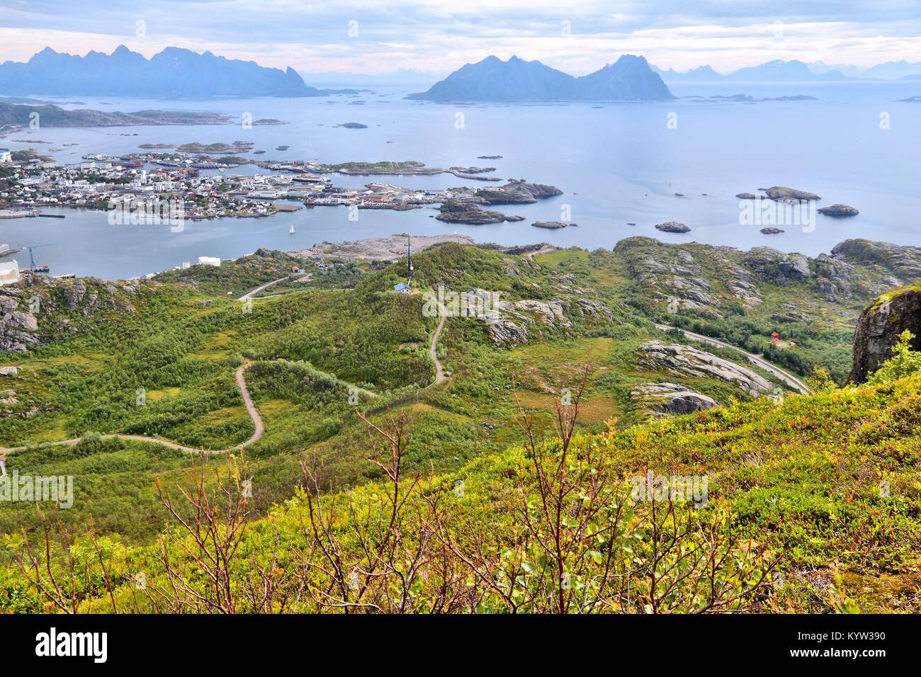 Lofoten archipelago in Arctic Norway. Svolvaer town view on Austvagoya island. Aerial view of Boreal zone from Tjeldbergtinden hiking trail. Stock Photo
