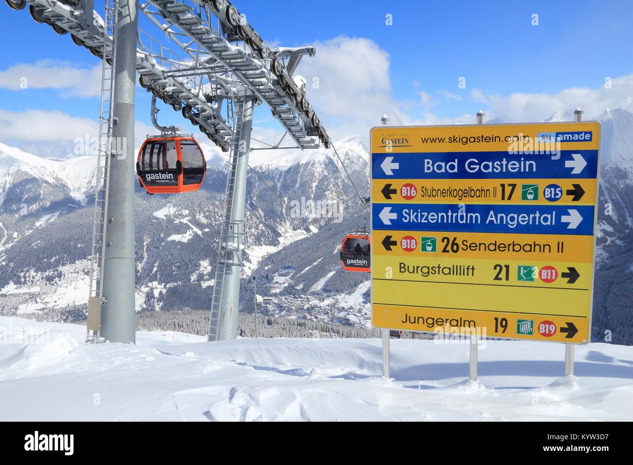 BAD GASTEIN, AUSTRIA - MARCH 10, 2016: People ride gondolas of cable car in Bad Gastein. It is part of Ski Amade, one of largest ski regions in Europe Stock Photo