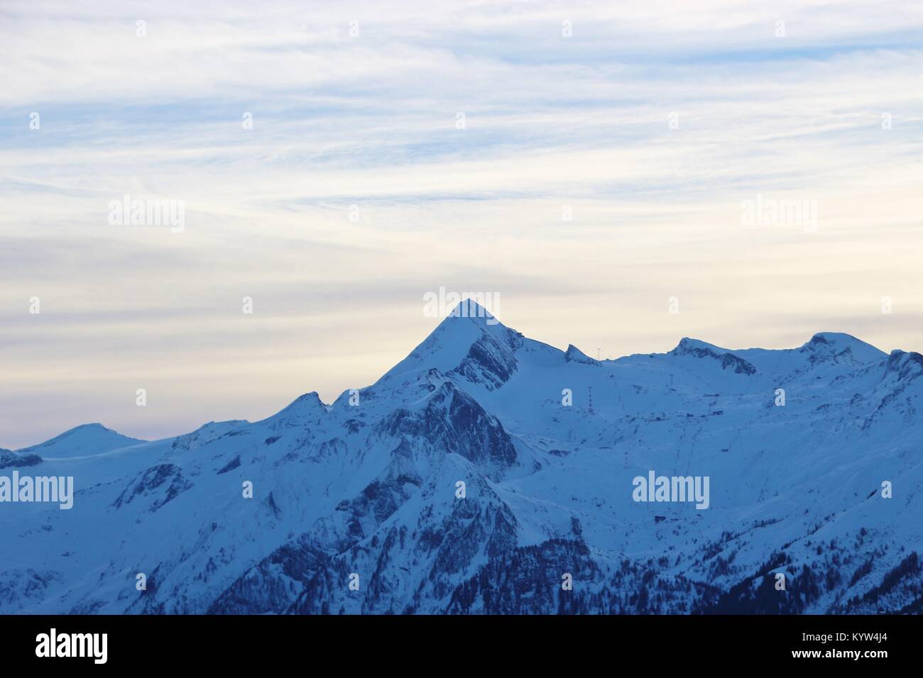 View of the Hohe Tauern mountain range with mountain Kitzsteinhorn (3200 m) in the region Zell am See - Kaprun, in winter. Austria, Europe. Stock Photo