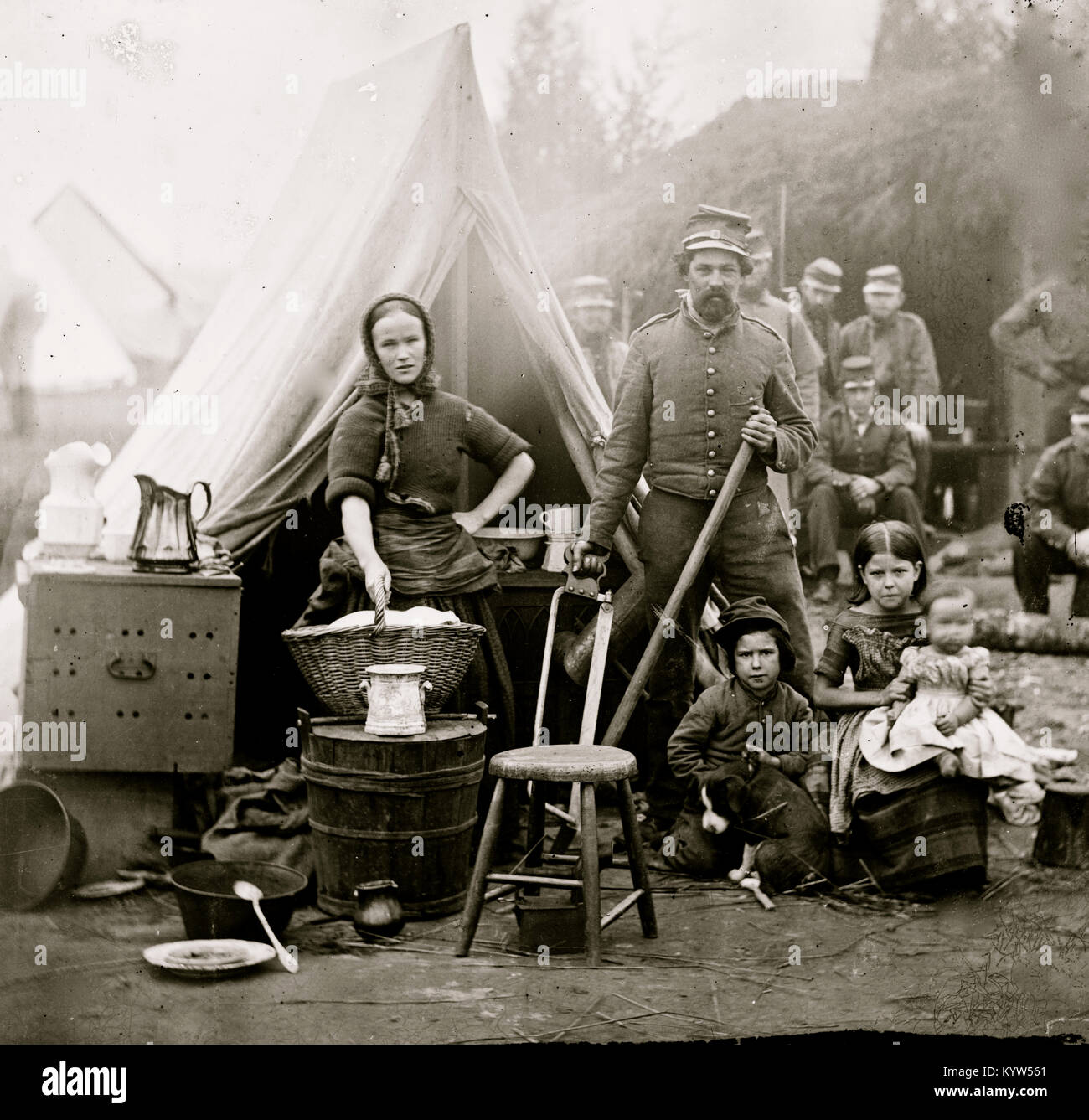 Washington, District of Columbia. Tent life of the 31st Penn. Inf. (later, 82d Penn. Inf.) at Queen's farm, vicinity of Fort Slocum; husband and wife with Children and a baby; wife does wash Stock Photo