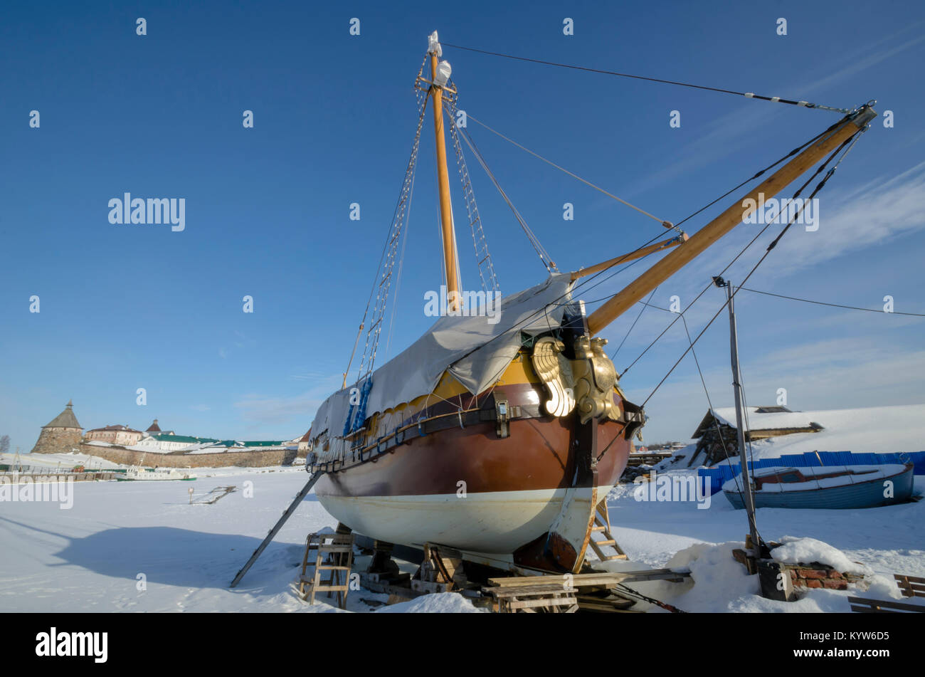 Wooden yacht against the background of the Solovetsky Monastery Stock Photo