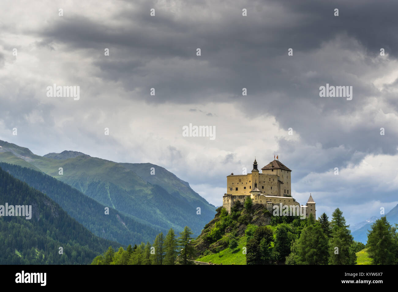 view of the beautiful castle of Tarasp and surrounding mountain ...
