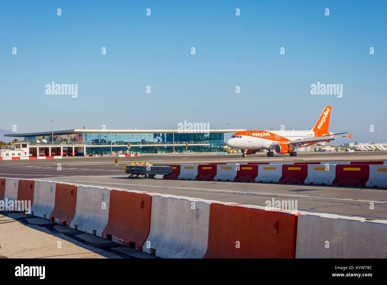 GIBRALTAR - NOVEMBER 19: Easyjet aircraft landing on a runway in Gibraltar airport. November 2016 Stock Photo