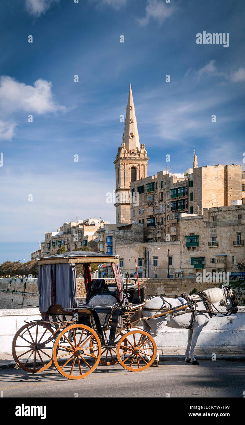 tourist horse drawn carriage in old town street of la valletta malta Stock Photo