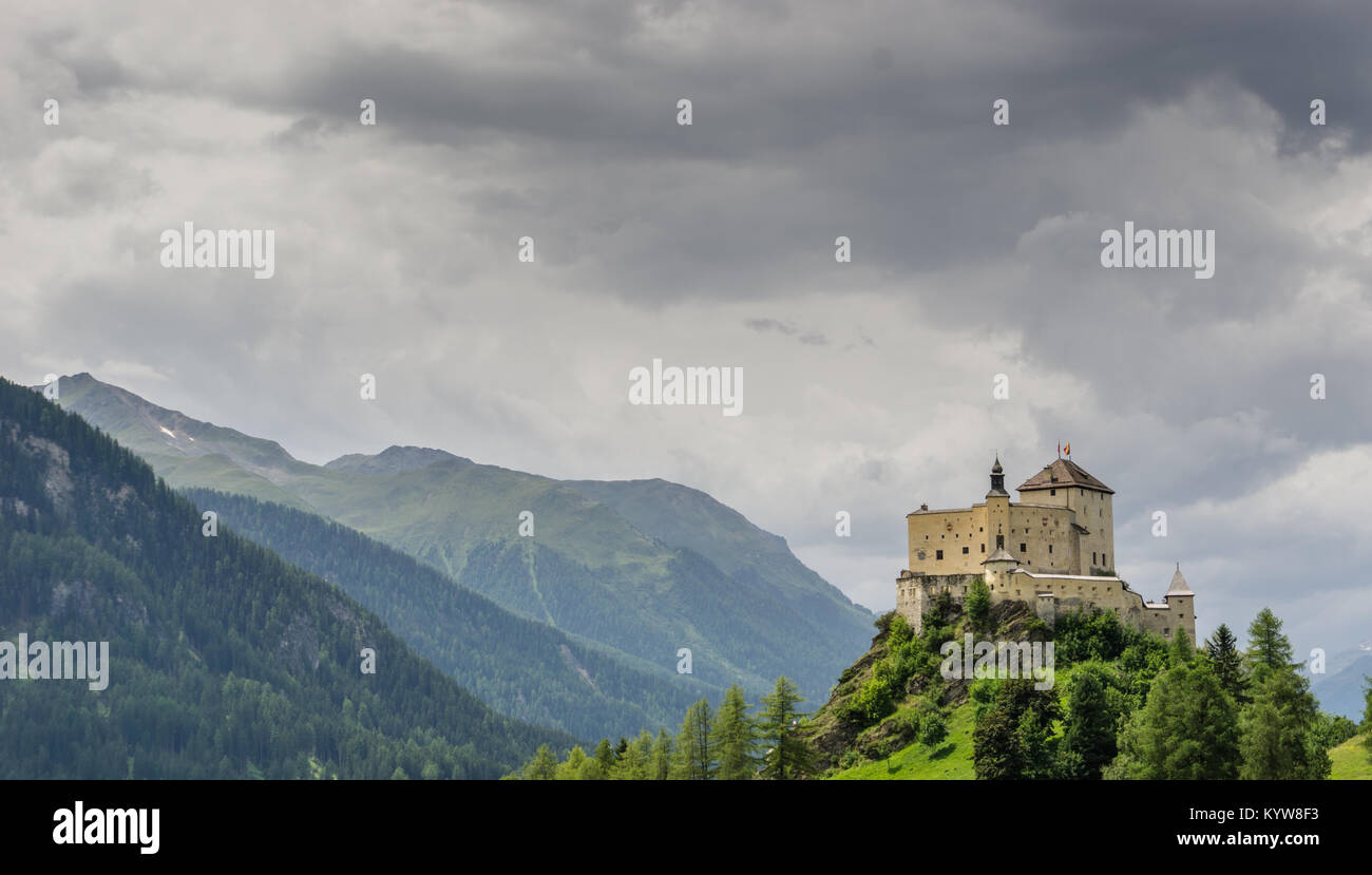 view of the beautiful castle of Tarasp and surrounding mountain landscape of the Engadin Valley in Switzerland Stock Photo