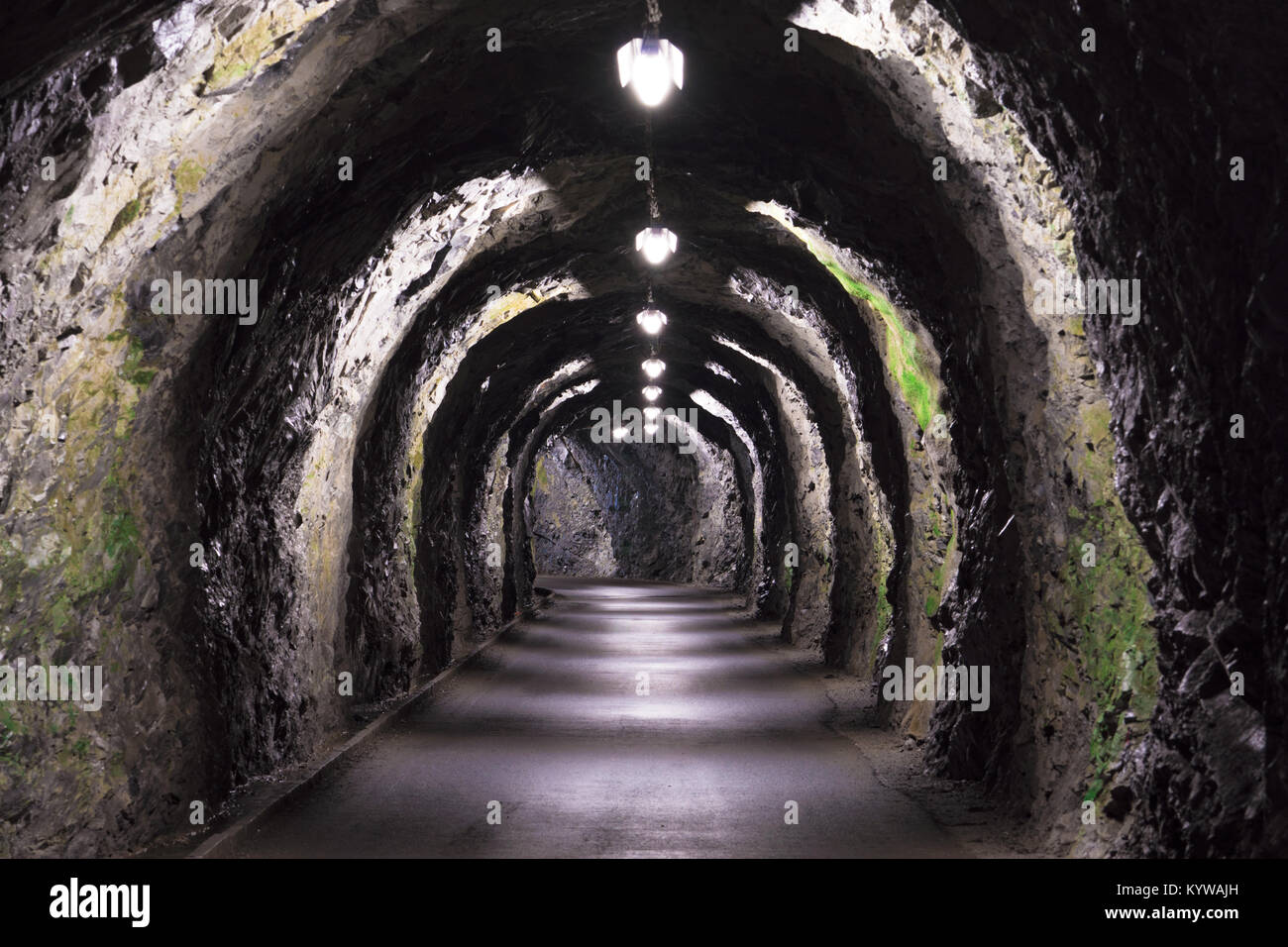 old rustic tunnel with sparse lighting Stock Photo - Alamy