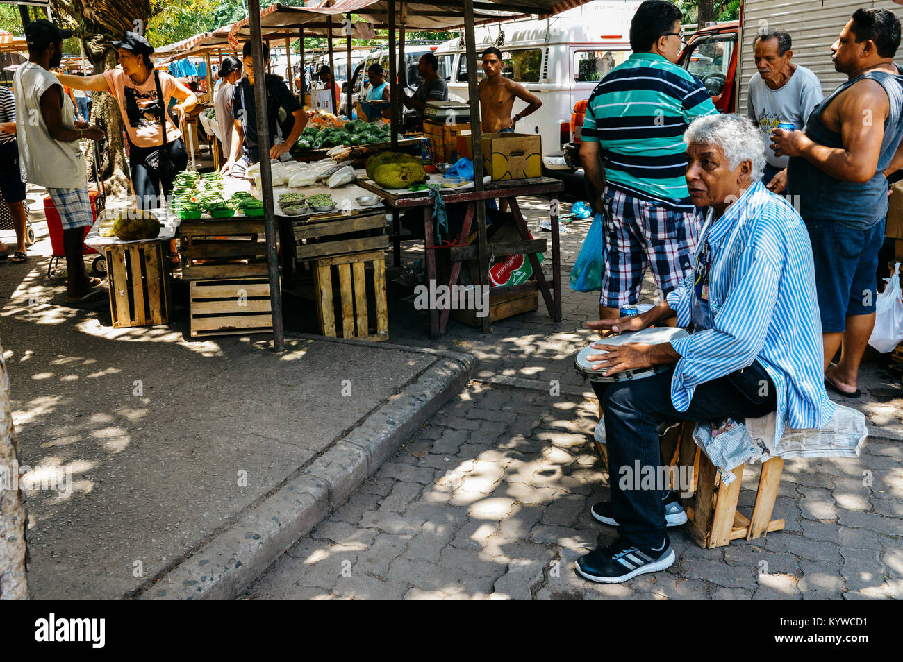 Man playing samba drums at street market in Rio de Janeiro, Brazil Stock Photo