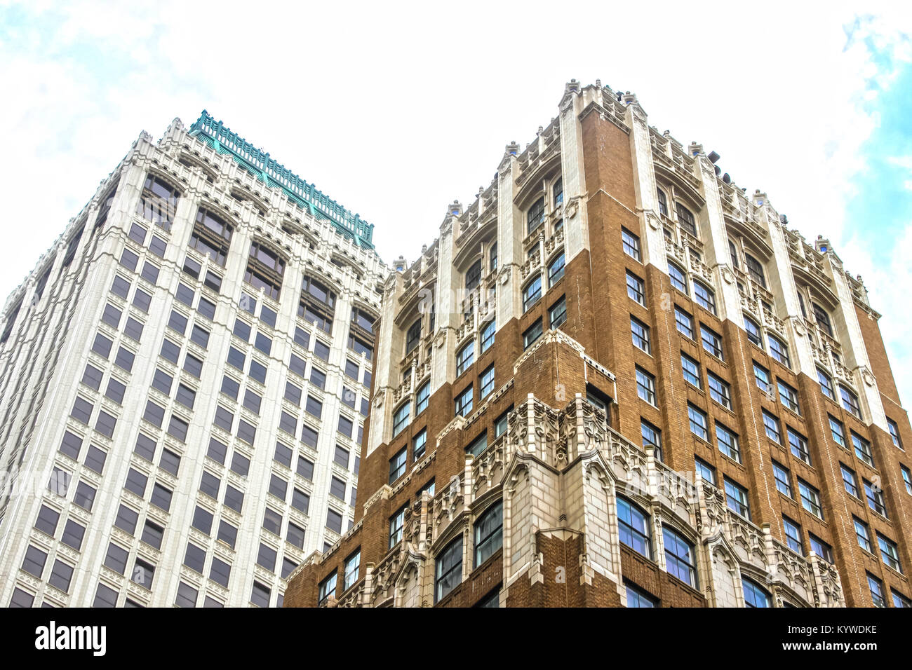 Angled view up at ornate old tall office buildings from street level Stock Photo