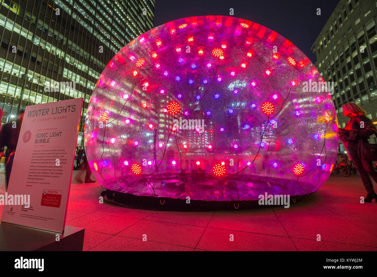 London, UK. 16th Jan, 2018. Winter Lights interactive art installations at Canary Wharf includes ‘Sonic Light Bubble' by Eness. A six-metre wide interactive bubble installation radiating light and sound when approached or touched, emitting a warm glow through 236 programmed LEDs constantly generating new visual patterns to a unique soundtrack. Credit: Guy Corbishley/Alamy Live News Stock Photo