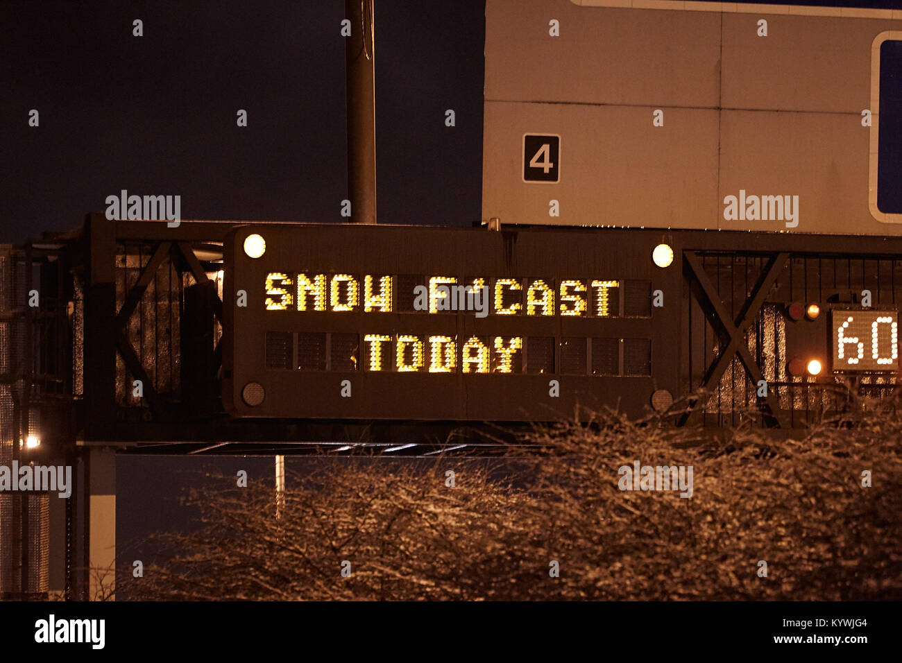 Newtownabbey, Northern, Ireland. 16th Jan, 2018. Motorway gantry warning sign of snowfall as amber weather warning as heavy snowfall starts to cover Newtownabbey outside Belfast, Northern Ireland, 16th January 2018 Credit: Radharc Images/Alamy Live News Stock Photo