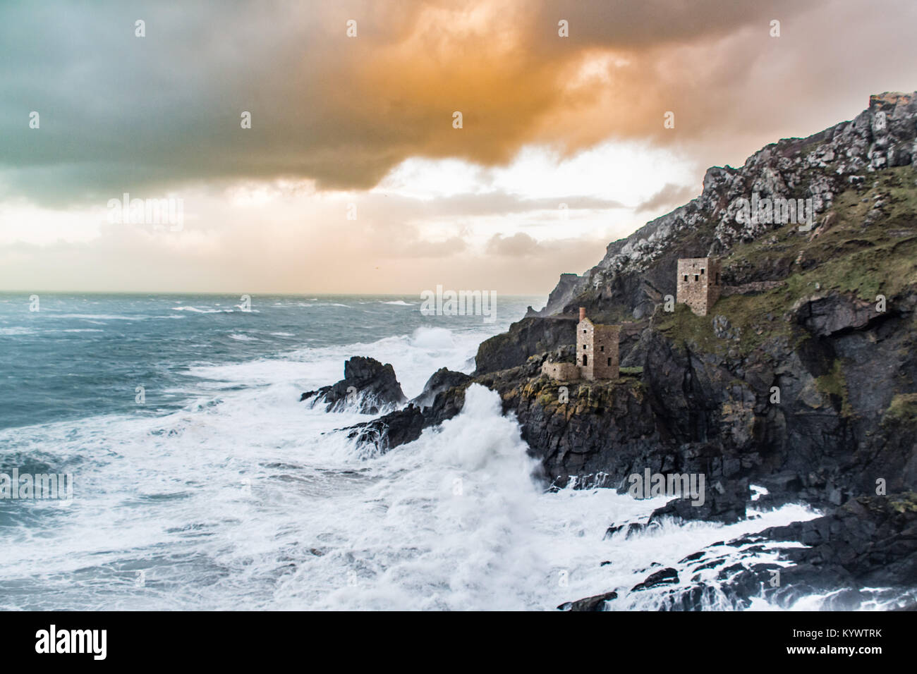 Botallack, Cornwall, UK. 17th Jan, 2018. UK Weather. Strong winds already hitting the north Cornwall coast, ahead of Storm Georgina later on today. Gusts of wind over 50mph made for a challenging picture this morning, perched on the cliffside to capture the tin mine buildings at Botallack, made famous by the recent Poldark series. Credit: Simon Maycock/Alamy Live News Stock Photo