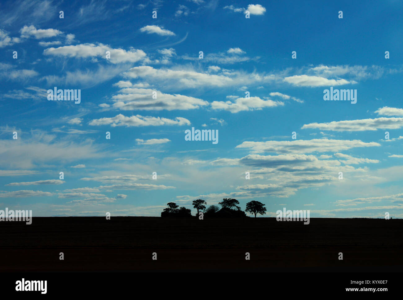 Big Sky and Silhouette of Isolated Farm House - Hinterlands of Queensland Australia Stock Photo