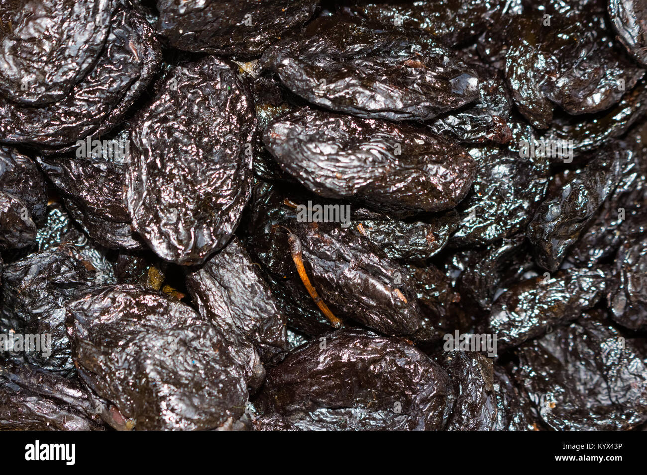 dried plums fruits on a pile on a food market, coloful dried fruits, dried fruits Stock Photo