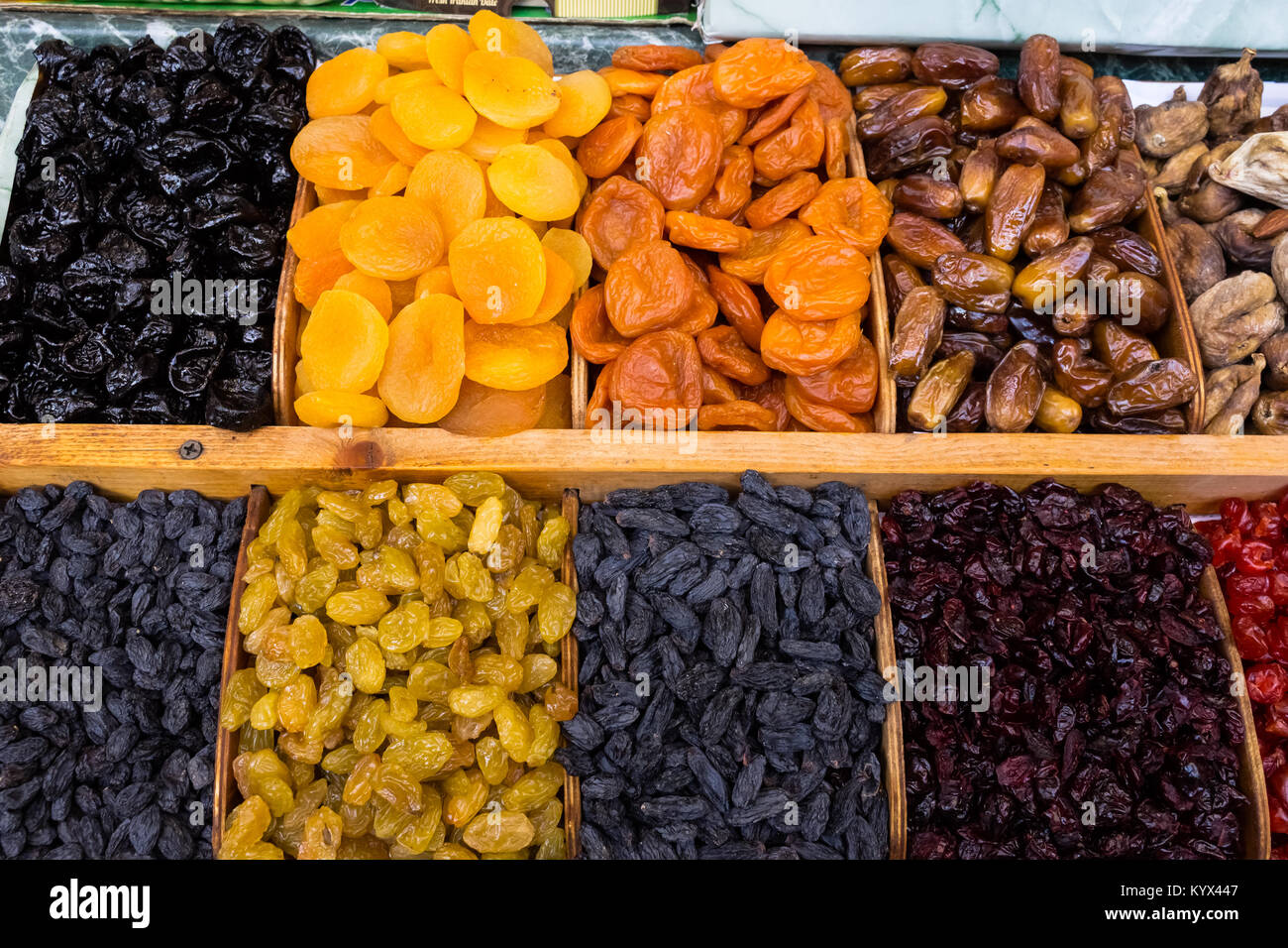 dry fruit mix on a pile on a food market, coloful dry fruits, dried fruits, different types of dry fruits, Assortment of dried fruits closeup backgrou Stock Photo