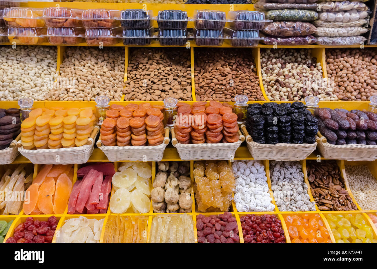 dried fruit mix with variations of nuts in rows on market, decorative pattern of dry exotic fruit and nuts. Top view. Stock Photo
