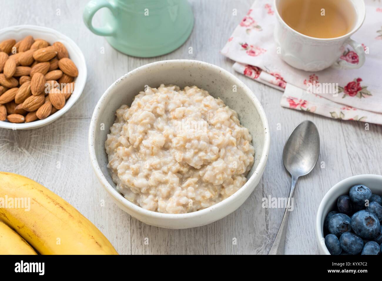 Porridge oats, scottish oats or oatmeal served with nuts, fruits