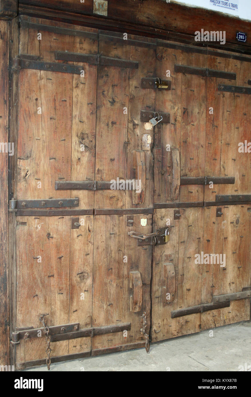 Arabic style art carved door with locks and many hinges, Stone Town ...