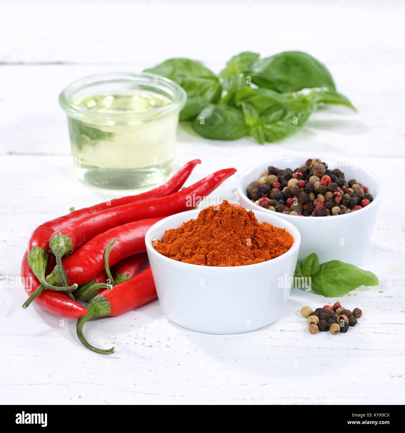 Spices cooking ingredients paprika powder square spicy red hot chili peppers chilli spice Stock Photo