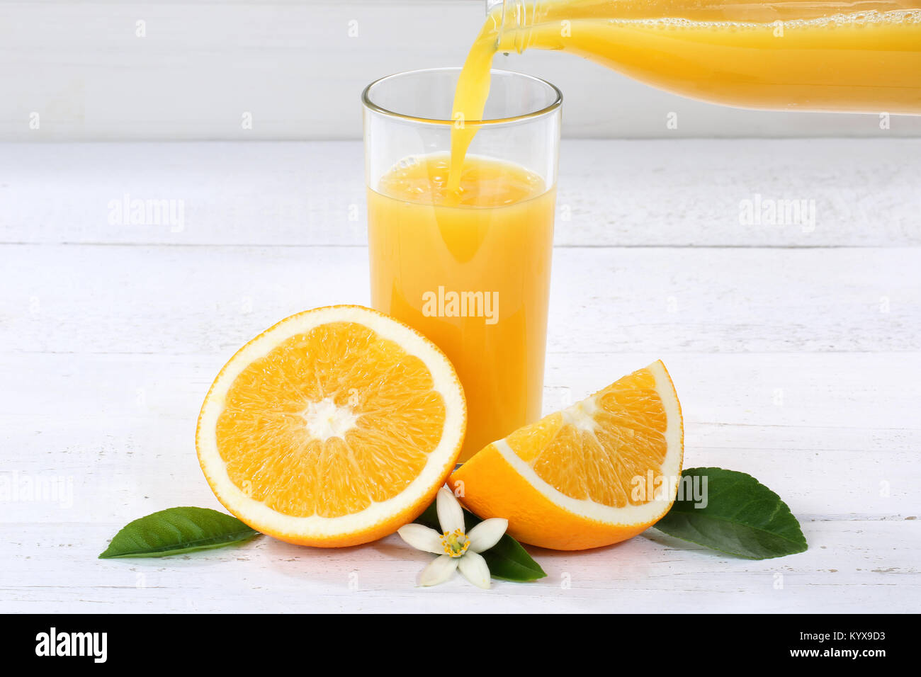 Orange juice pouring pour bottle oranges fruit fruits drink Stock Photo