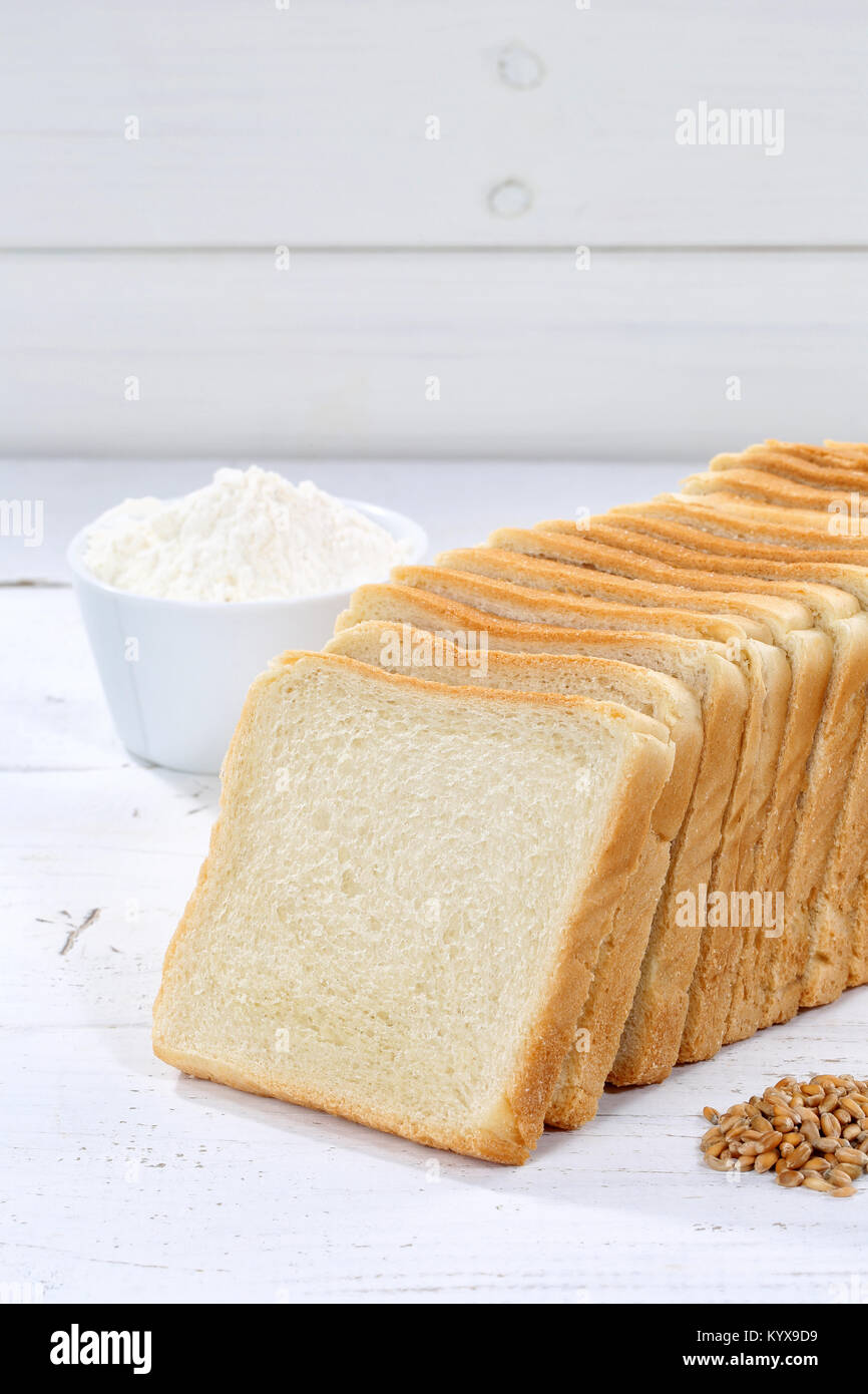 Toast bread slice slices sliced portrait format copyspace on wooden board wood Stock Photo