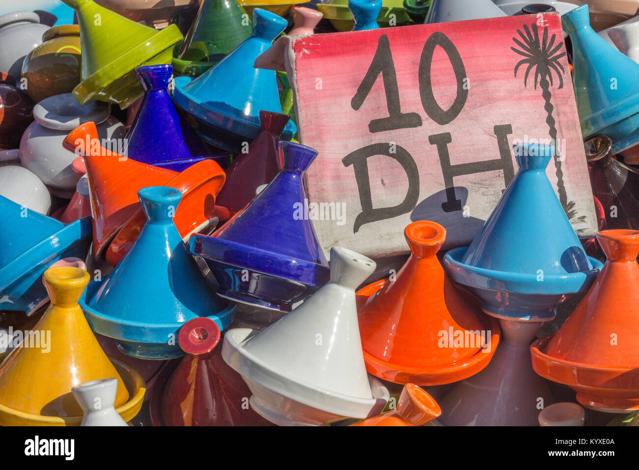 A selection of colourful tagines for sale on a stand in Jemaa el-Fnaa, Marrakesh, Morocco Stock Photo
