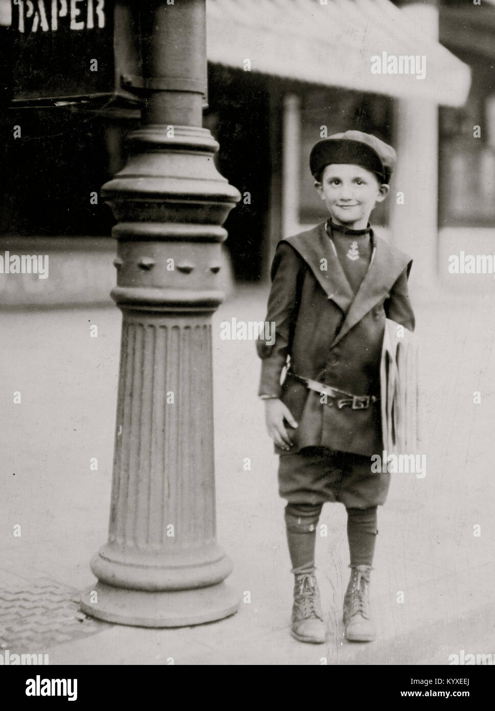 7 yr. old news-boy, without a badge, who tried to 'short-change' me when he sold me a paper. Stock Photo