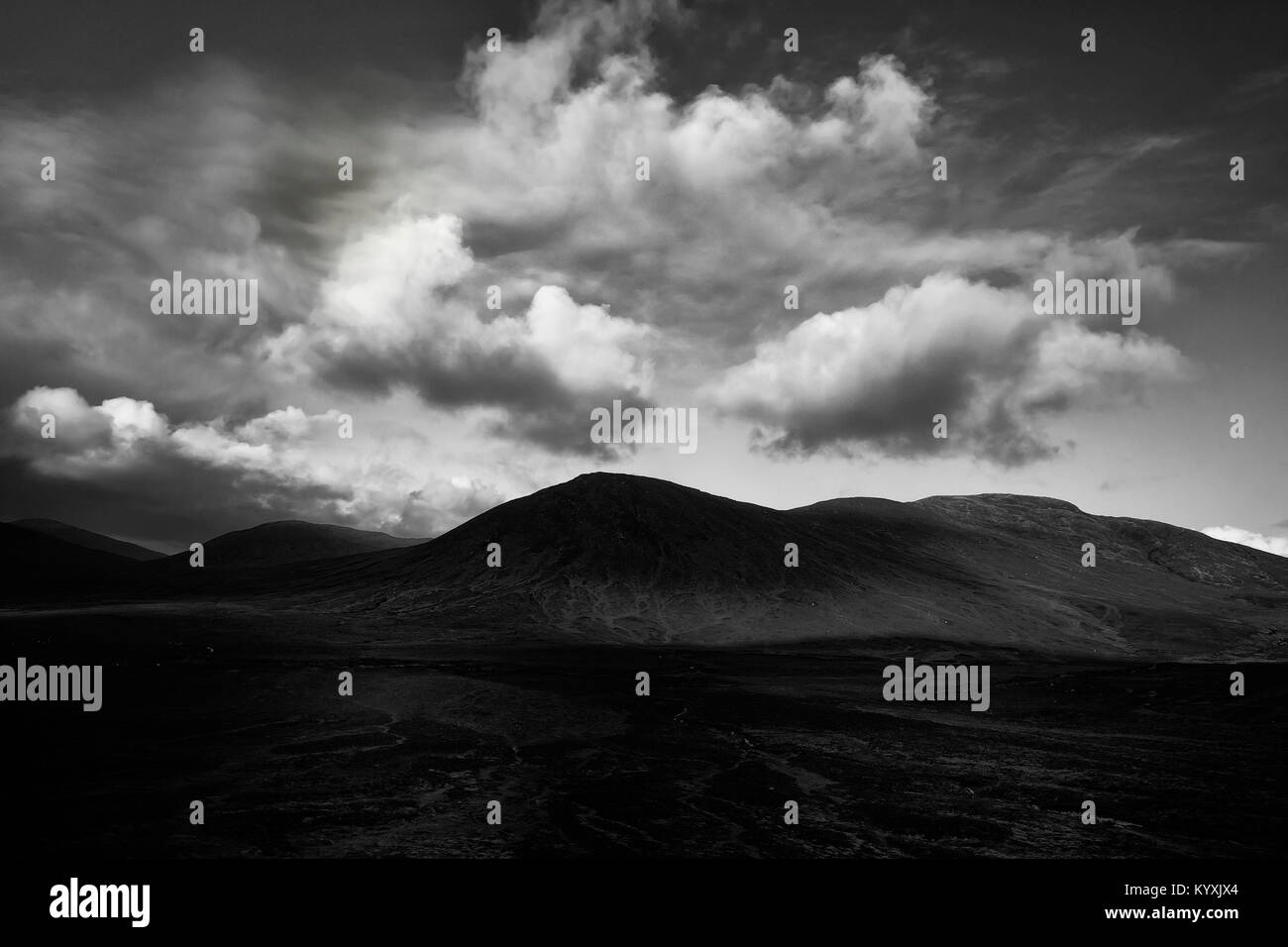 clouds forming over mountain tops Stock Photo