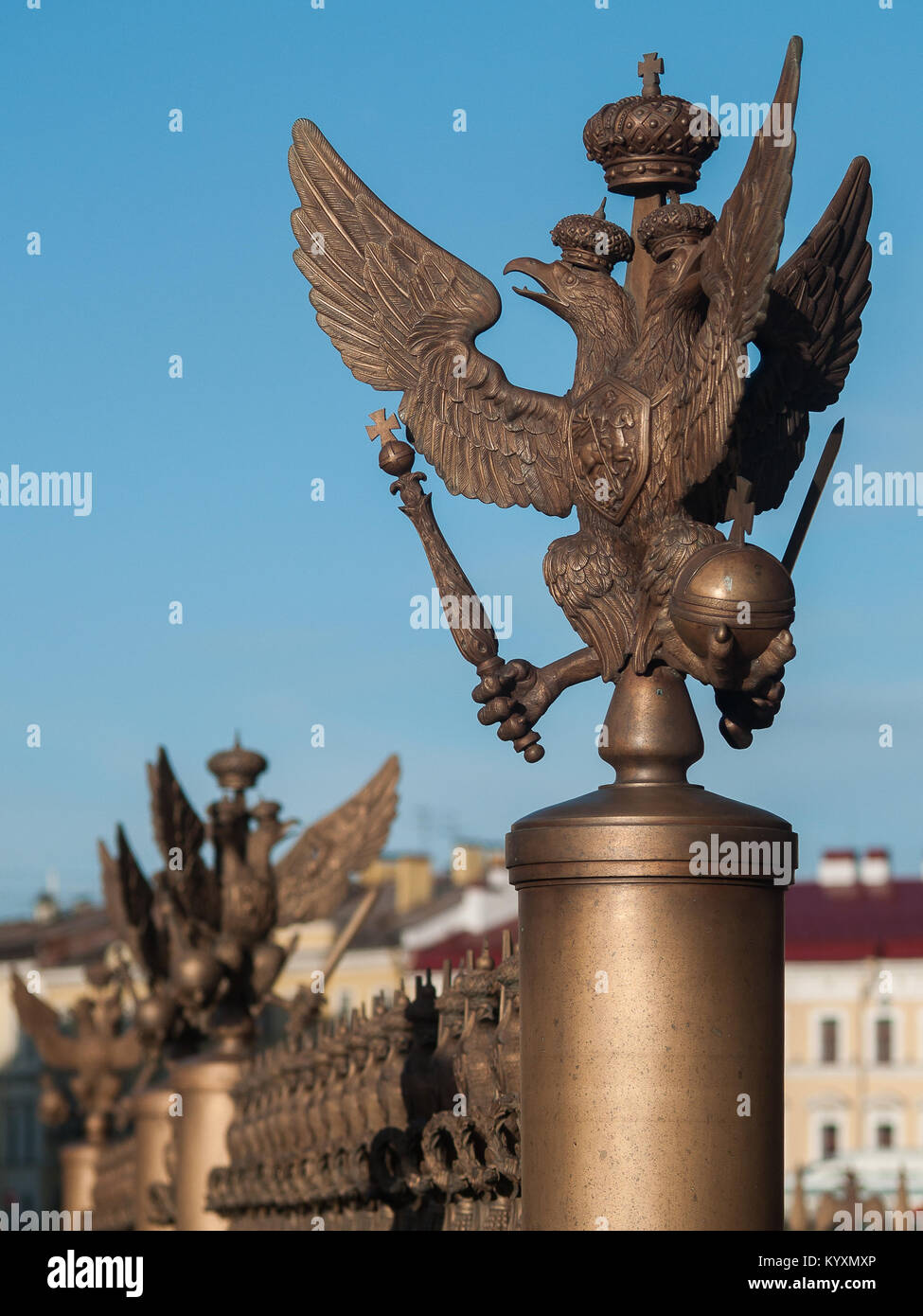 Figure of the three-headed eagle in the imperial crown on the fence of the pillar of Alexandria on Palace Square in the center of St. Petersburg, Russ Stock Photo